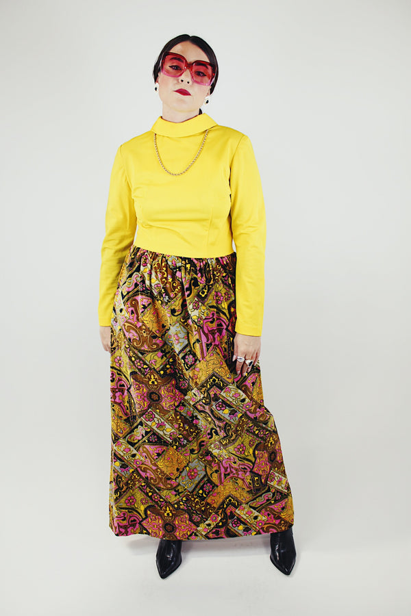 long sleeve mock neck twofer maxi dress with a yellow top part and velvet brown paisley printed skirt vintage 1970's