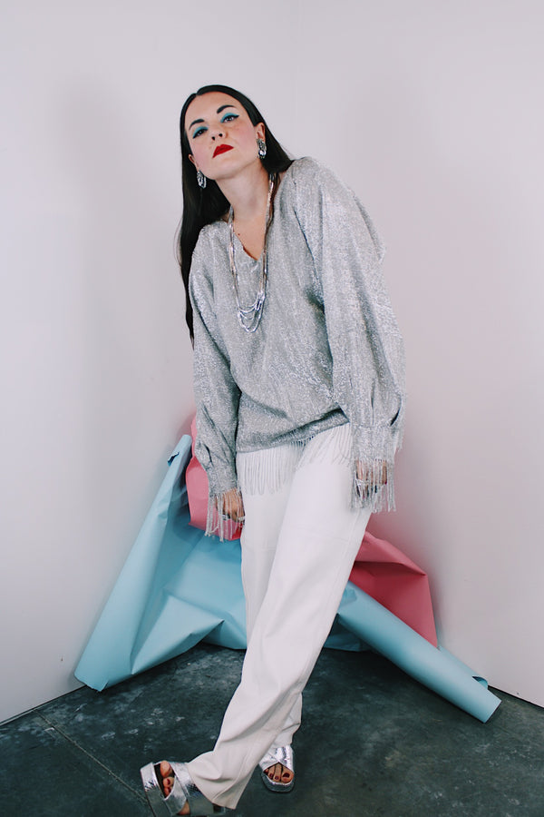 Women's vintage 1970's Saks Alley label long sleeve silver metallic blouse with fringe trim on cuffs and hem