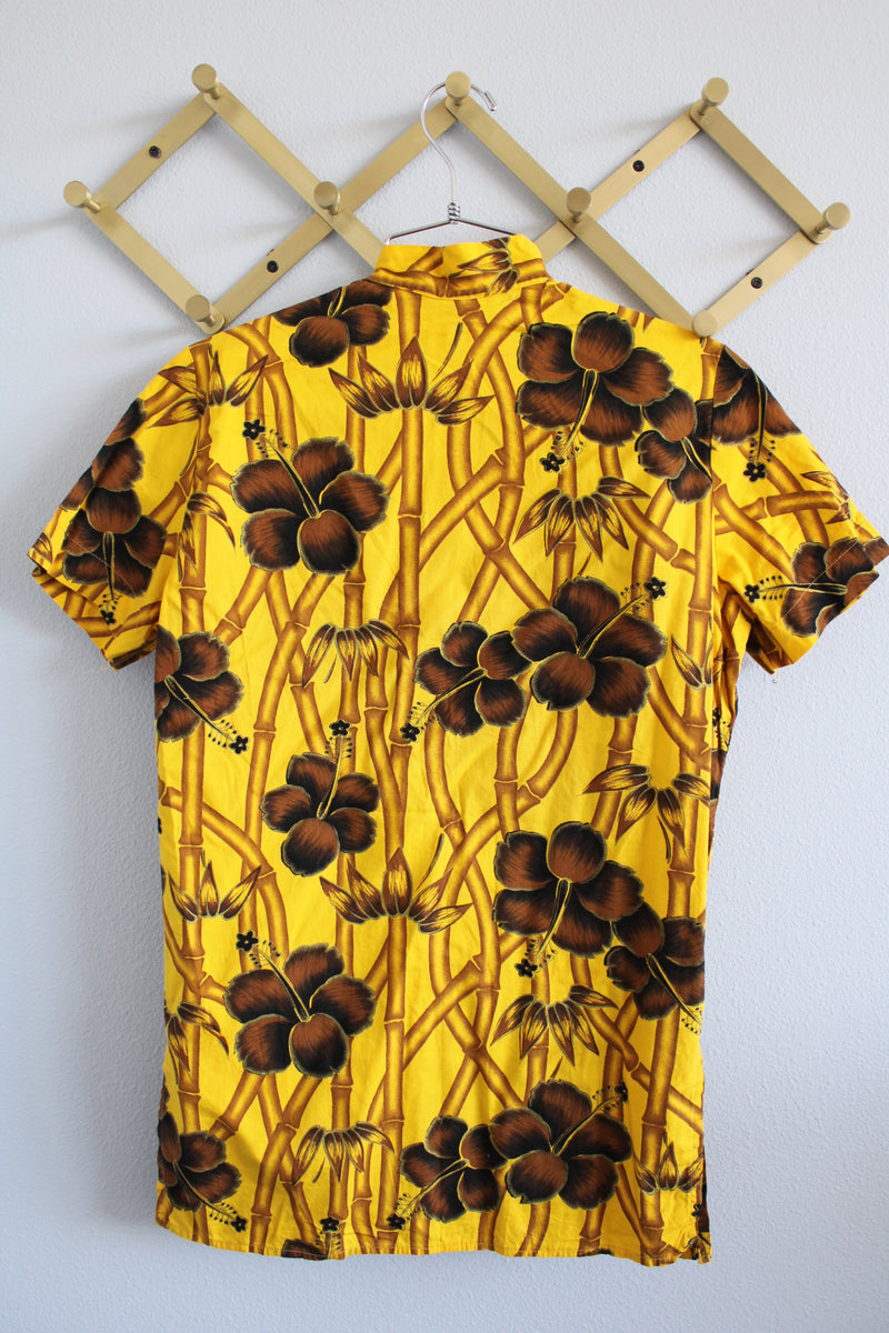 Women's vintage 1970's La Rosa, San Francisco label short sleeve button up blouse in yellow with all over brown Hawaiian print.