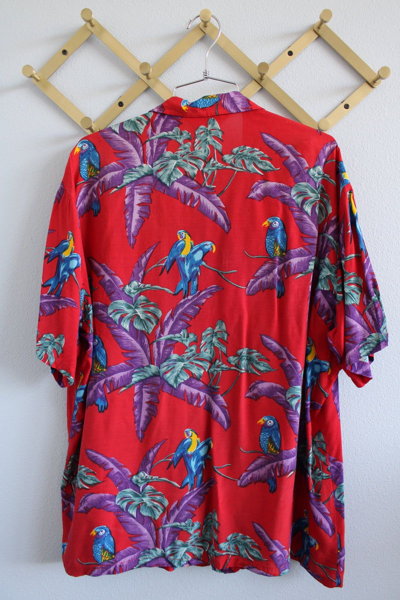 Men's vintage 1970's Michael Gerald Ltd., Hand Screened short sleeve button up shirt in an all over Hawaiian print with parrots.