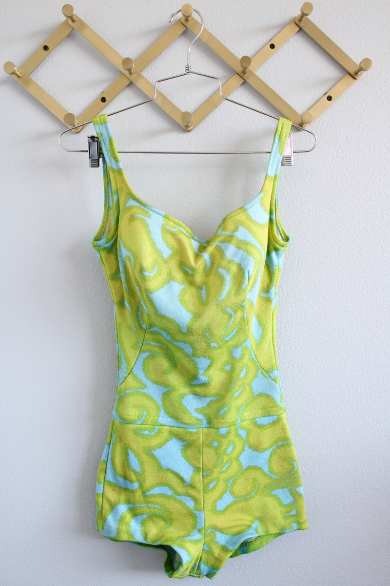 Women's vintage 1960's Jantzen, Made in USA label sleeveless one piece swimsuit in a green and blue print.