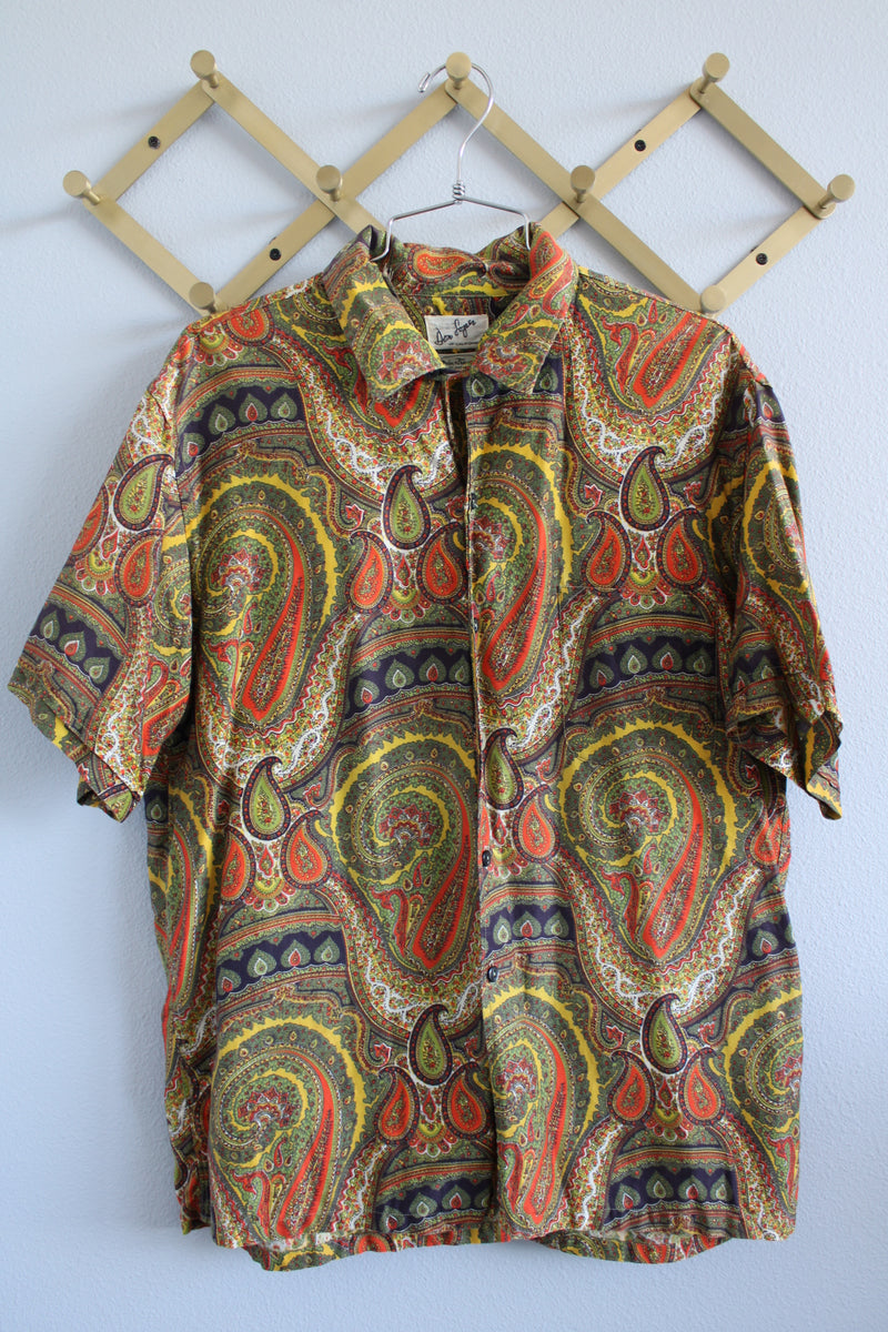 Women's or men's vintage 1960's Don Soper of California label short sleeve button up shirt with collar. All over paisley print in green, yellow, and orange.