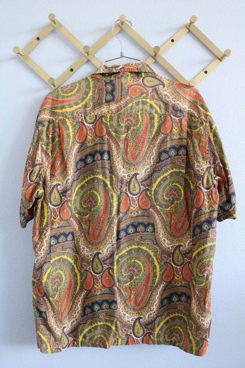 Women's or men's vintage 1960's Don Soper of California label short sleeve button up shirt with collar. All over paisley print in green, yellow, and orange.