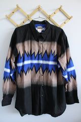 Men's vintage 1980's Express Rider label long sleeve button up shirt with a black, blue, and beige Western style print.