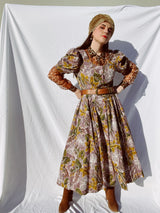 purple and green floral printed midi length dress with short sleeve puff sleeves buttons up the front vintage 1980's