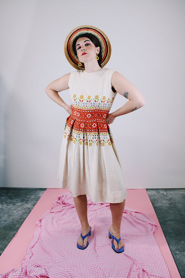 sleeveless knee length dress in tan with floral print in the middle linen vintage 1960's
