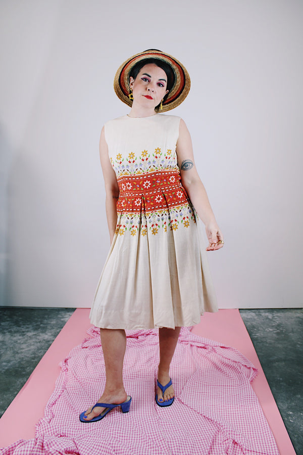 sleeveless knee length dress in tan with floral print in the middle linen vintage 1960's