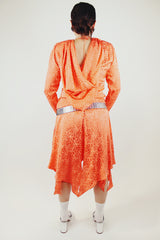 long sleeve orange silk dress with polka dot print and asymmetrical hem vintage 1980's