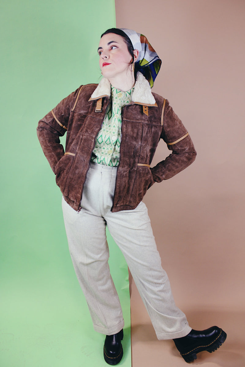 Women's vintage 1970's Ms. Pioneer label long sleeve brown suede short zip up jacket with cream faux fur trim on collar. 