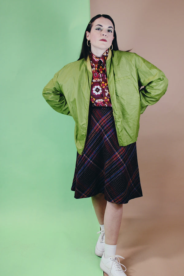 Men's or women's vintage 1960's Puritan Gary Player Sportswear, Made in USA label long sleeve olive green lightweight nylon bomber jacket with a zipper in the front. 