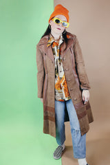 Women's vintage 1970's New England Sportswear Company label long length brown suede and leather trench coat that buttons up the front.
