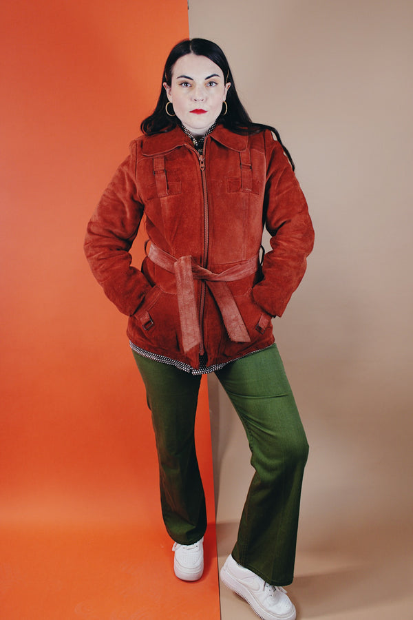 Women's vintage 1970's Genuine Leather, Made in Uruguay label burn orange suede leather zip up jacket with collar and matching tie belt and a faux fur liner