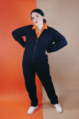 Women's or men's vintage 1980's Reminiscence by Stewart Richer label zip up one piece jumpsuit in a black cotton material. 