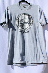 short sleeve grey vintage tee with coin graphic on the front vintage 1982 quarterflash tour tee