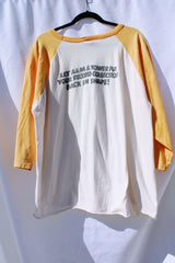 long sleeve vintage baseball tee cream body with yellow arms 1976 tower records graphic on front and back