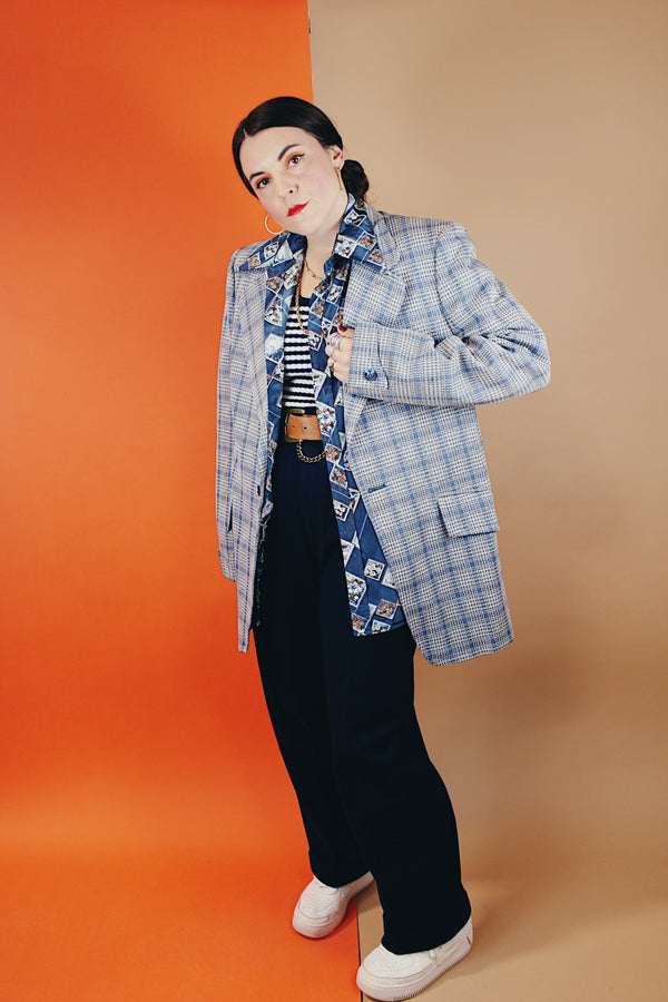 Men's vintage 1970's Montgomery Ward polyester double breasted blazer in a grey and blue plaid print.
