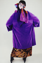 purple velvet coat with 3/4 arm length buttons up the front and attached neck tie vintage women's 1960's