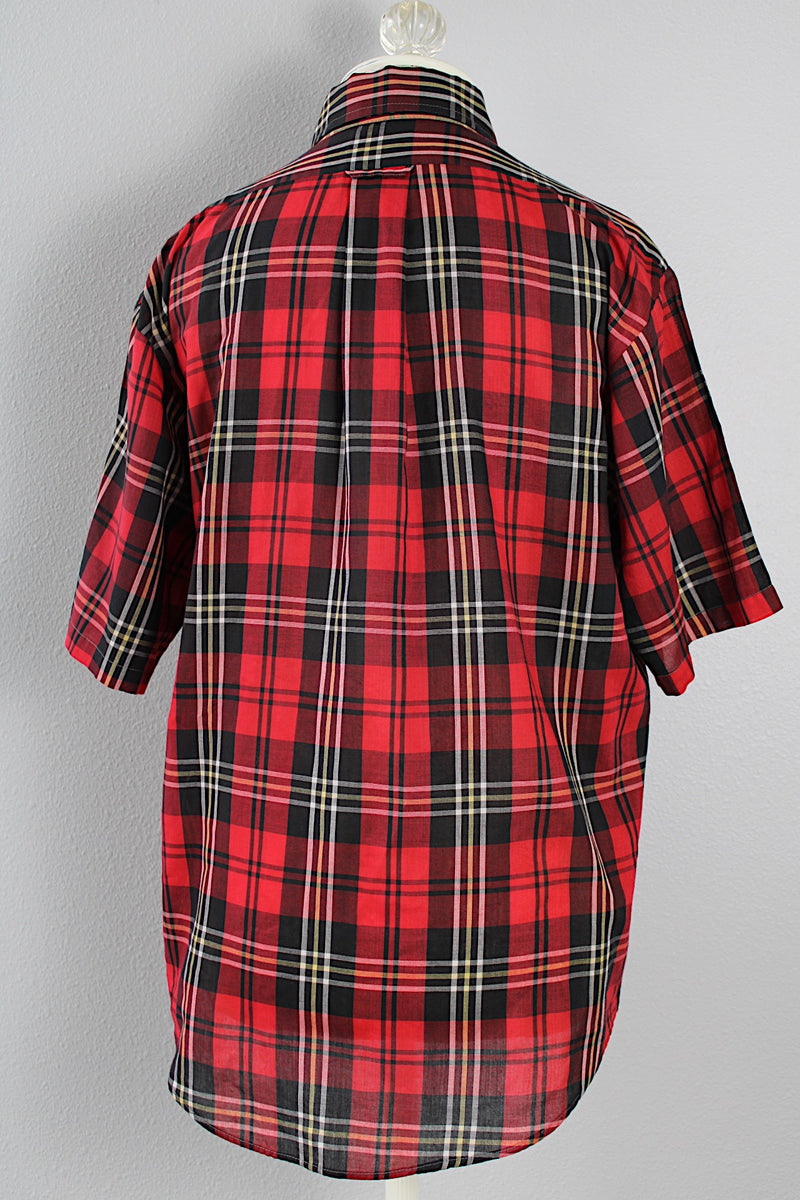 Women's or men's vintage 1970's Golden Award short sleeve plaid print button up shirt with pointy collar. Polyester cotton blend material in a red, black, white, and yellow plaid print.
