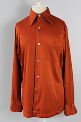 Men's vintage 1970's Joel California label long sleeve button up polyester material shirt in a rich burnt orange.