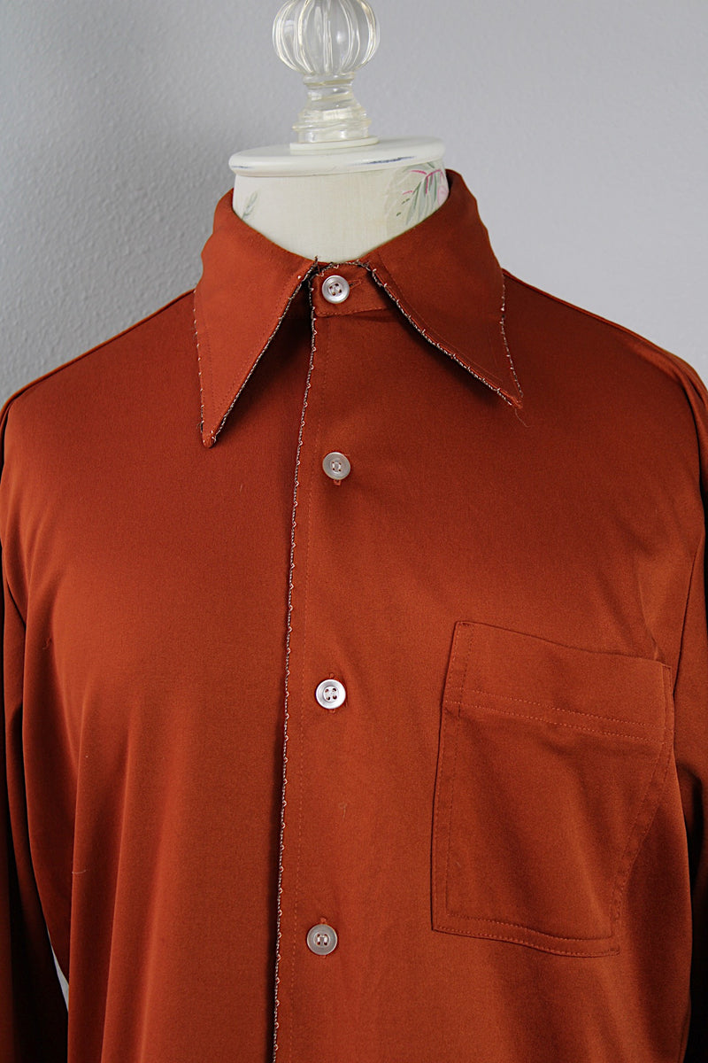 Men's vintage 1970's Joel California label long sleeve button up polyester material shirt in a rich burnt orange.