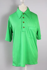 Women's or men's vintage 1970's Designed by David Harrison label short sleeve half button shirt with pointy collar in a bright vibrant green color. 