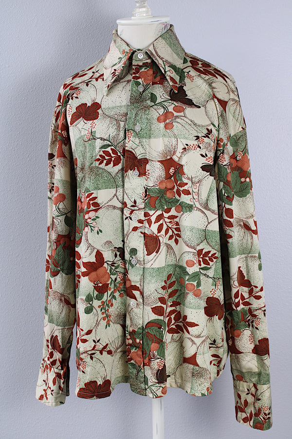 Men's or women's vintage 1970's Jean Joint label long sleeve button up shirt with a pointy collar in green with an all over brown floral and butterfly print.