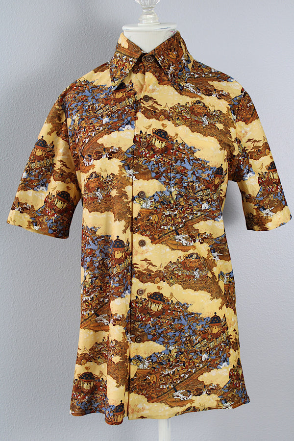Women's or men's vintage 1970's short sleeve button up shirt with a pointy collar, brown buttons, and all over print in lightweight, soft polyester material