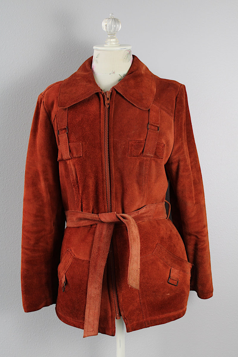 Women's vintage 1970's Genuine Leather, Made in Uruguay label burn orange suede leather zip up jacket with collar and matching tie belt and a faux fur liner