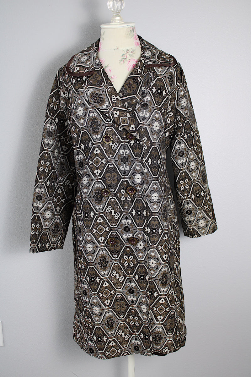 Women's vintage 1960's long sleeve long length brown and white tapestry print coat with a double breasted closure.