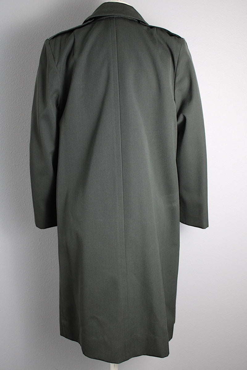 Women's vintage 1960's long sleeve cotton double breasted trench coat in a grey green color.
