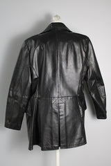 Women's vintage 1970's Adler Leather, Made in California label long sleeve black leather jacket with a double breasted closure