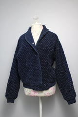 Women's vintage 1970's Woolrich Woman, Made in USA label long sleeve navy fleece sweater. Popper buttons up the front, two pockets, rolled collar, and white speckle print all over.