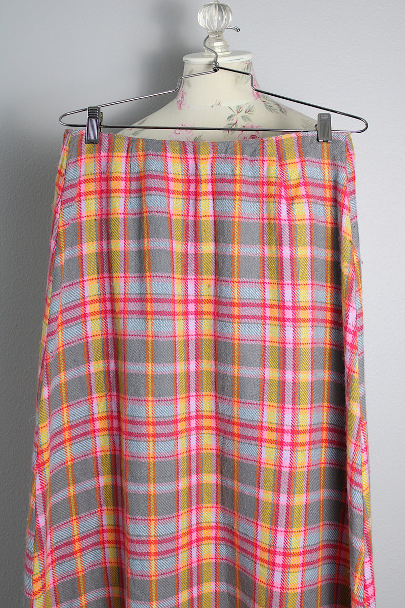 Women's vintage 1970's ankle length maxi skirt in an acrylic material with plaid print and a-line shape.