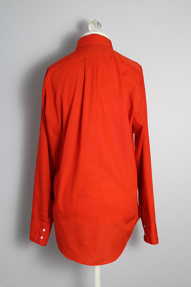 Men's or women's vintage 1970's Manhattan Traditionals long sleeve button up shirt with pointy collar in a red orange tomato color in a polyester cotton blend material with one left chest pocket. 
