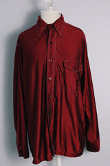 Men's vintage 1970's JCPenney Towncraft label long sleeve button up shirt with a pointy collar in maroon colored lightweight polyester material with white contrast stitching and a left chest pocket.