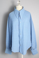 Men's or women's vintage 1970's long sleeve light blue polyester button up shirt with very pointy dagger collar and puff sleeves. 