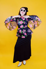 dress with pink floral top half and black bottom bell sleeves and floor length vintage 1970's