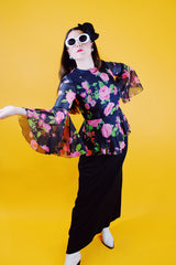 dress with pink floral top half and black bottom bell sleeves and floor length vintage 1970's