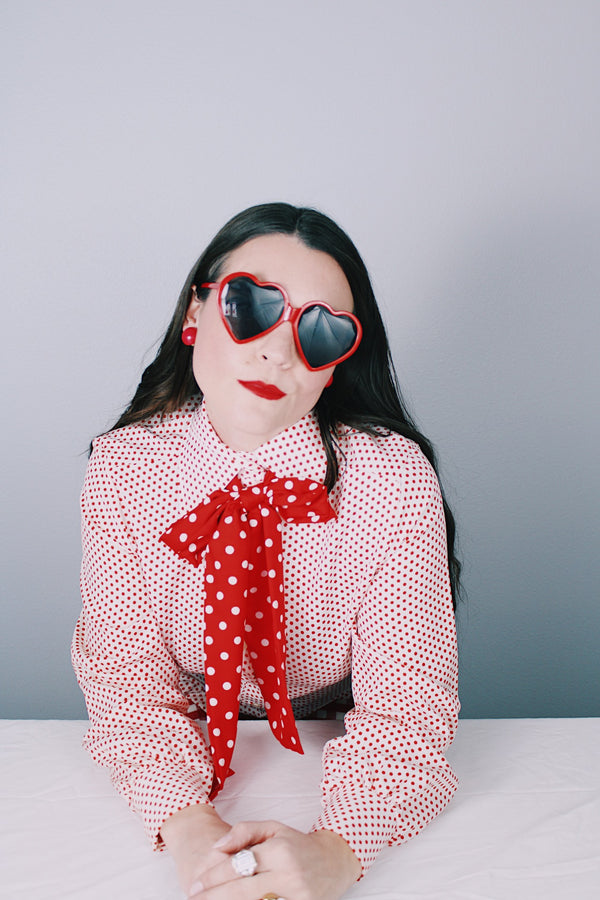 Women's vintage 1970's Lady Arrow label long sleeve white polyester button up blouse with red polka dots. Dagger collar and detachable adjustable tie neck.