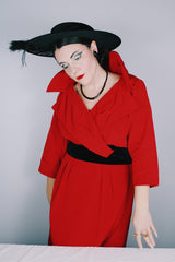 Women's vintage 1950's Jr. Plenty Shop, Lane Bryant label 3/4 arm length midi length red dress with V shaped neckline, black velvet waistband and double lapel collar.