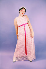 sleeveless pink dress with polka dot sheer lace overlay and ribbon around waist vintage 1960's