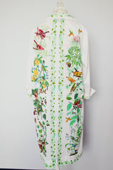 long sleeve mid length shirt dress in white with all over bird print polyester women's vintage 1960's