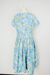 short sleeve blue floral print midi length dress with a line structure women's vintage 1960's