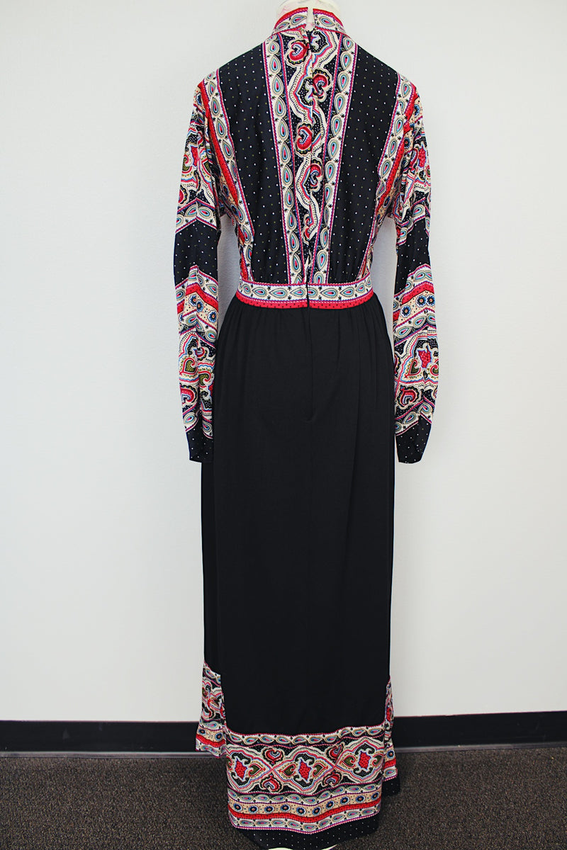 long sleeve v neck maxi dress in black with paisley print vintage 1970's