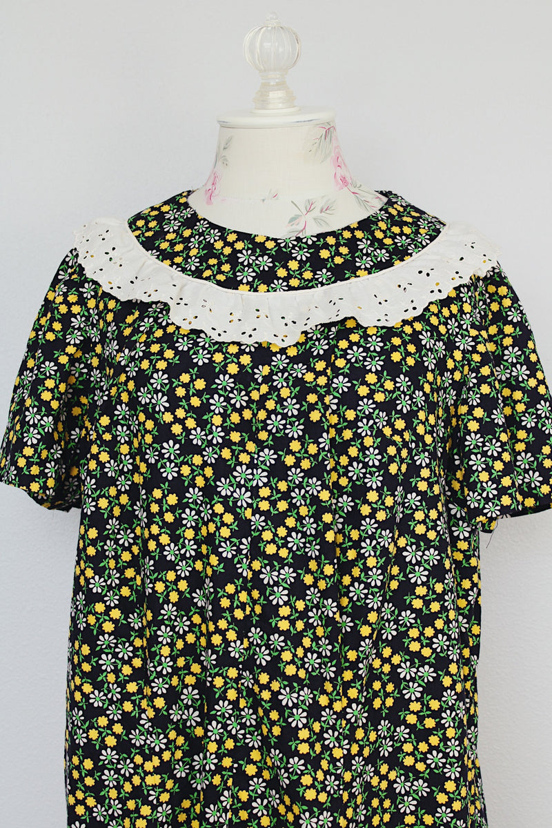short sleeve ankle length black green and yellow floral printed dress with white eyelet trim vintage 1960's