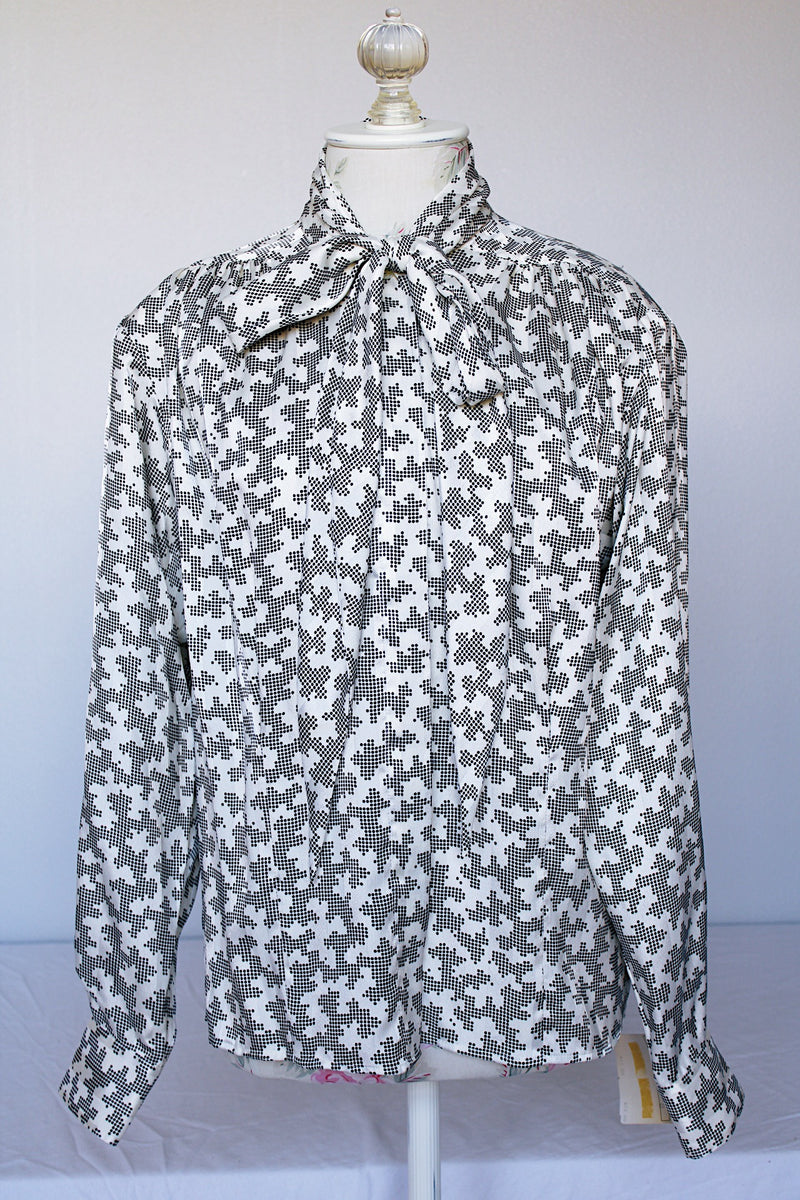 Women's vintage 1980's Evan-Picone, Neiman-Marcus label long sleeve button up. blouse in white polyester material with all over black abstract print.