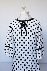 Women's vintage 1960's Gallant California short sleeve white linen dress with black polka dots all over. Has black bow tie on neck. 