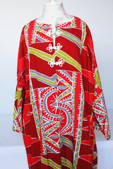 Women's vintage 1970's long sleeve printed cotton muu muu dress in red, green, grey, and white.