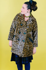 Women's vintage 1970's long sleeve long leopard print double breasted coat in velvet material. 