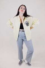 long sleeve light yellow zip up sport jacket with crest on left chest vintage 1970's